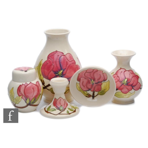 2 - Five pieces of Moorcroft comprising a baluster vase, a small ginger jar and cover, a footed bowl, a ... 