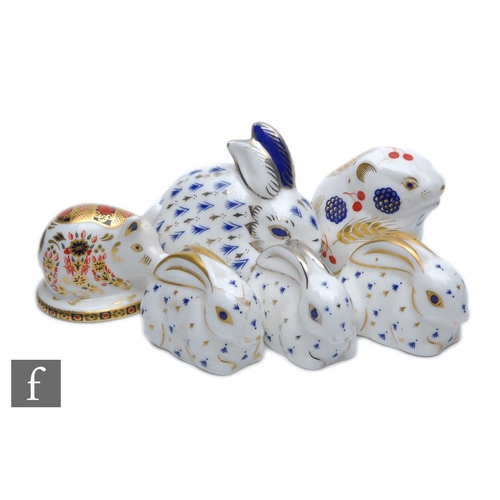 21 - Six assorted Royal Crown Derby paperweights comprising three seated rabbits with gold stoppers, a pi... 