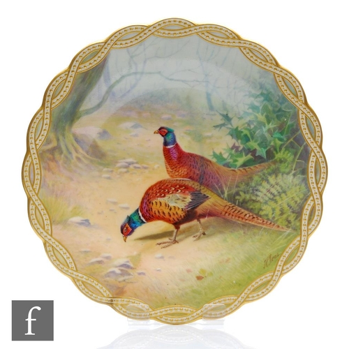 27 - An early 20th Century Minton cabinet plate decorated by J. E Dean with two hand painted pheasants ag... 