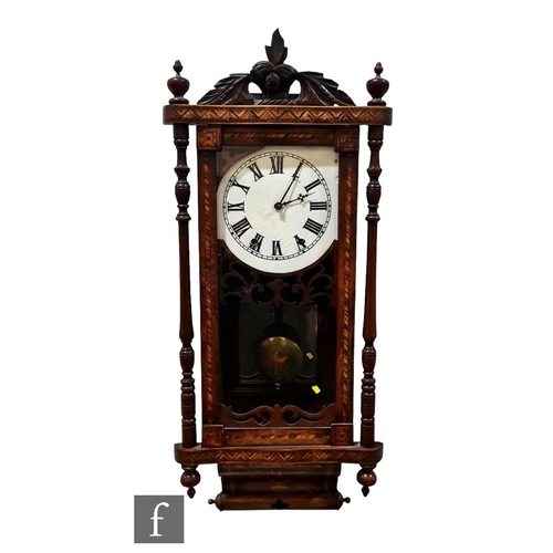 462 - A late 19th Century marquetry inlaid wall clock, painted dial over a glazed door and scroll base, he... 