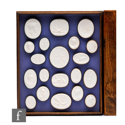 475 - A collection of replica Grand Tour plaster cameo plaques contained and mounted in four trays, each p... 