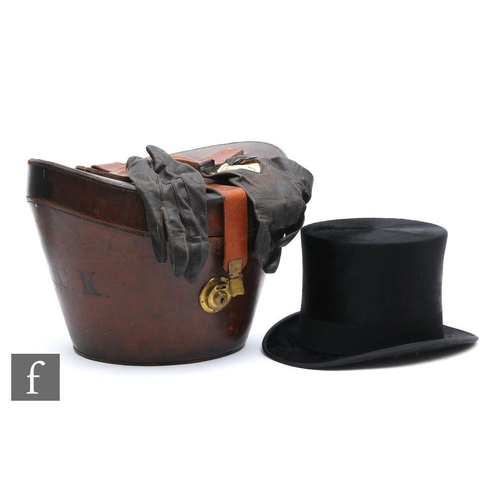 477 - A late 19th Century black felt top hat by Herbert Johnson, 38 New Bond Street London, in leather hat... 