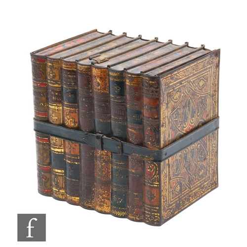 480 - A Huntley & Palmers biscuit tin in the form of eight books, bound with a metal strap below an op... 