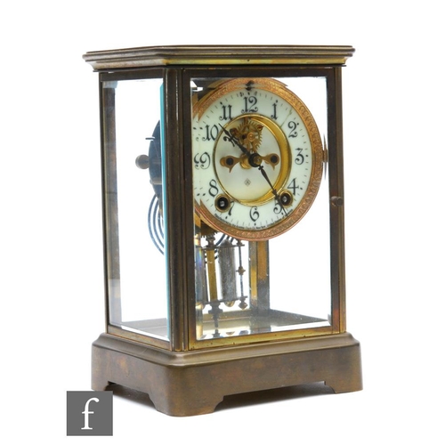 482 - An early 20th Century brass cased Ansonia mantle clock, the dial, gong and mercury filled pendulum e... 