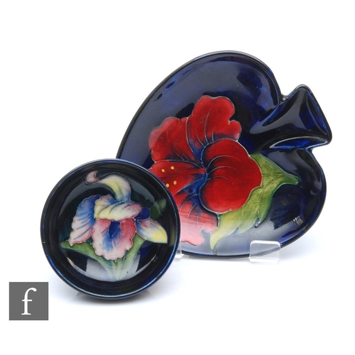 49 - Two pieces of Moorcroft comprising a small footed bowl decorated in the Frilled Orchid pattern, mark... 