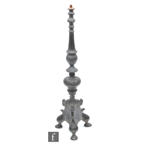 519 - A 17th Century style pricket cast metal candlestick, the knopped stem raised to a triform base, lack... 