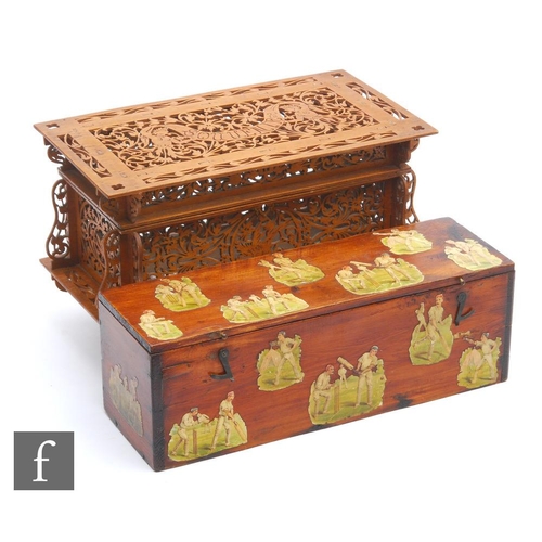 521 - An early 20th Century French fret carved walnut box, the hinged top decorated with a merman holding ... 