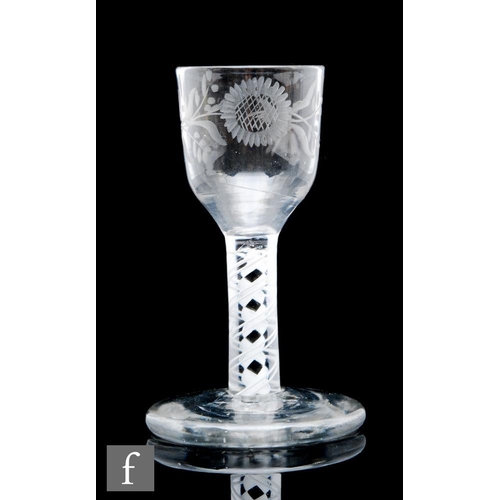 591 - An 18th Century cordial drinking glass, the ogee footed bowl engraved with a stylised flower and fol... 