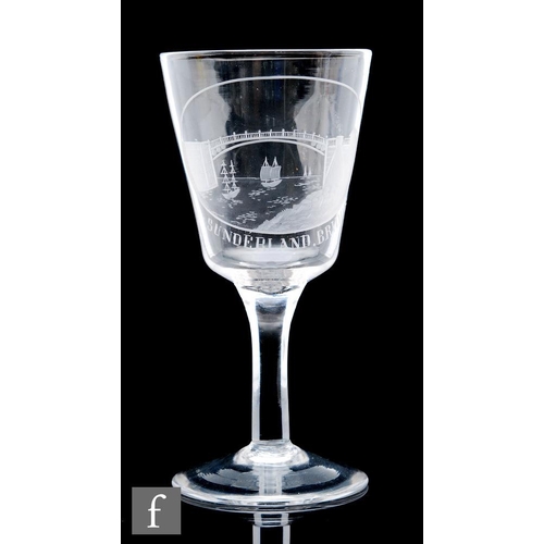 592 - A late 18th Century large goblet circa 1800, the flared bucket bowl decorated with an engraved panel... 