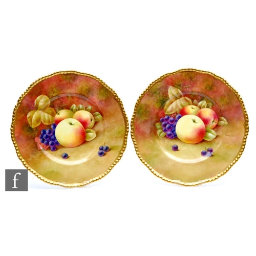 60 - Two Coalport cabinet plates decorated by Richard Budd with hand painted apples and red grapes, both ... 