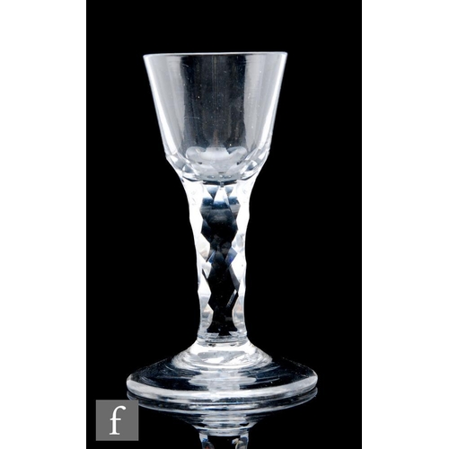 600 - A large 18th Century drinking glass circa 1780, the ovoid bowl falling to a heavy hollow diamond fac... 