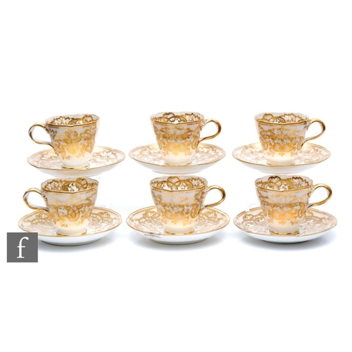 66 - A set of six 19th Century teacups and saucers, probably Ridgeway, each decorated with a gilt repeat ... 