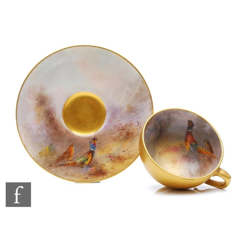 90 - An early 20th Century Royal Worcester cabinet cup and saucer decorated by Jas Stinton with hand pain... 