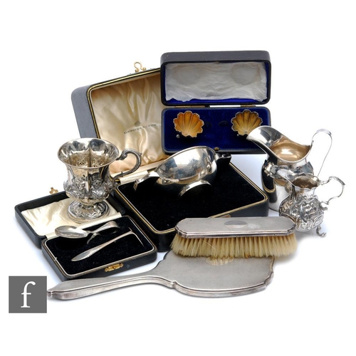 267 - A parcel lot of assorted hallmarked silver items to include two cream jugs, a cased quaiche, a pedes... 