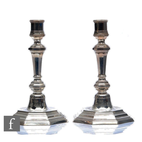 278 - A pair of early 20th Century stepped octagonal shaped candlesticks with knopped columns, height 22cm... 