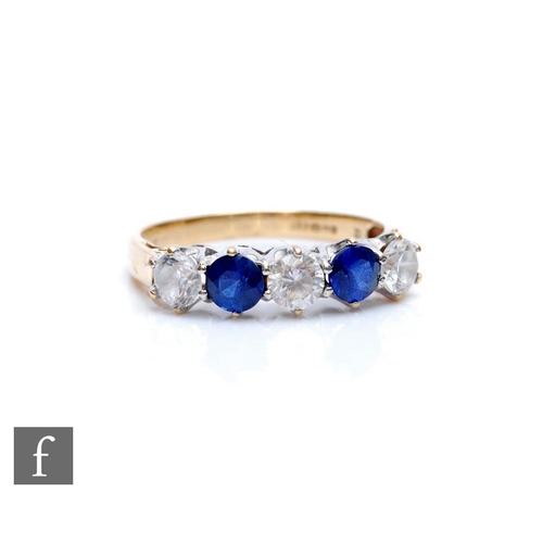 305 - A 9ct hallmarked cubic zirconia and sapphire five stone ring, alternate stones to plain shoulders, w... 