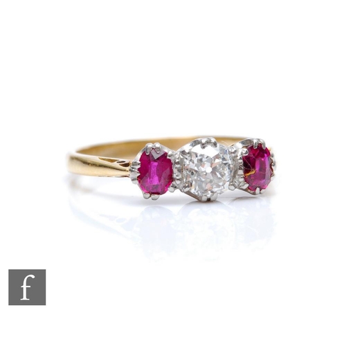 307 - An 18ct ruby and diamond three stone ring, central old cut diamond, weight approximately 0.40ct, fla... 