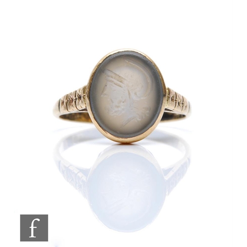 312 - A 9ct single hard stone ring, oval stone with intaglio carved profile of a Roman soldier, weight 4g,... 