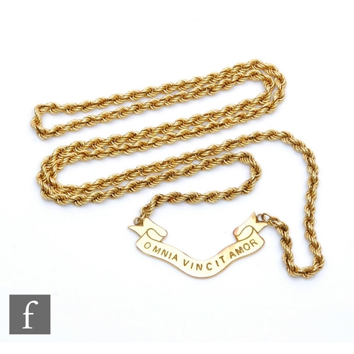 315 - A 9ct hollow link rope chain with a central panel engraved 'Love Conquers All' in Latin, weight 29g,... 