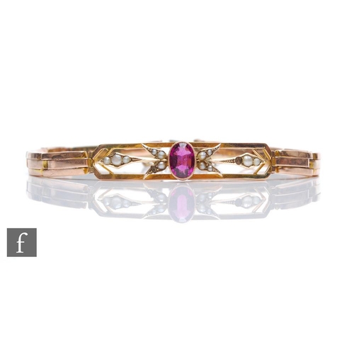 319 - An early 20th Century 9ct rose gold expanding bracelet with a central single amethyst stone to a pie... 