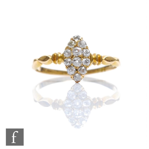 326 - An early 20th Century diamond marquise shaped cluster ring comprising twelve stones to ribbed should... 