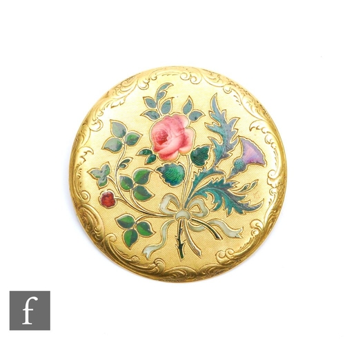 371 - An 18ct circular brooch decorated with an enamel floral spray, weight 7.7g, diameter 35mm, possibly ... 