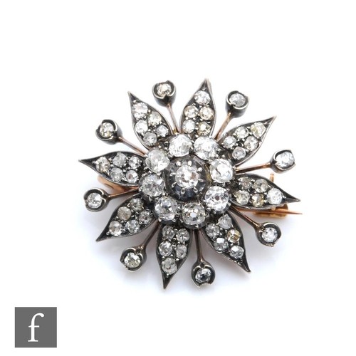 373 - A 19th Century 9ct diamond floral target brooch/pendant, comprising old cut stones, weight 8g, diame... 