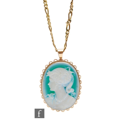 379 - A 9ct oval cameo pendant, profile of a young woman, suspended from a 9ct figero chain, total weight ... 