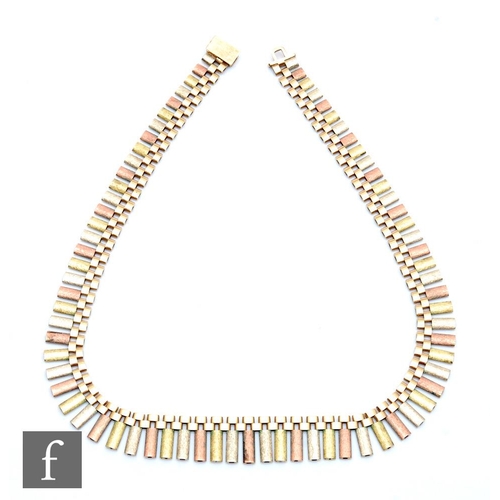 385 - A 9ct hallmarked tri coloured graduated flattened tubular necklet, weight 42.5g, length 42cm, termin... 