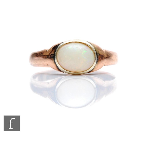 389 - An early 20th Century 9ct single stone opal ring, collar set to a plain rose gold shank, weight 2g, ... 