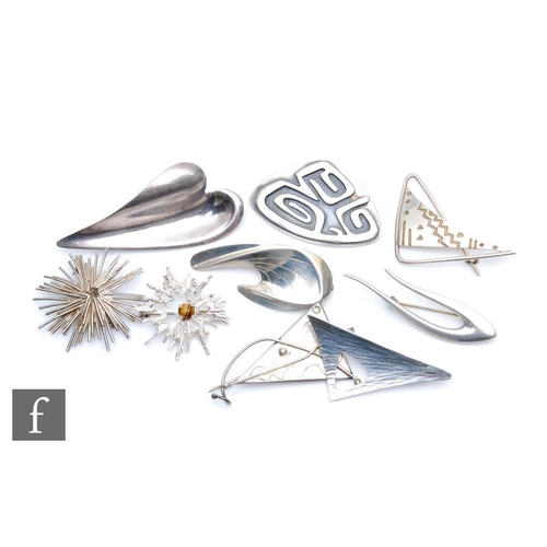 394 - Nine assorted mid 20th Century silver brooches of varying form to include four hallmarked silver exa... 