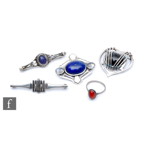 411 - An early 20th Century Arts and Crafts style brooch set with a blue hardstone cabochon and two moonst... 