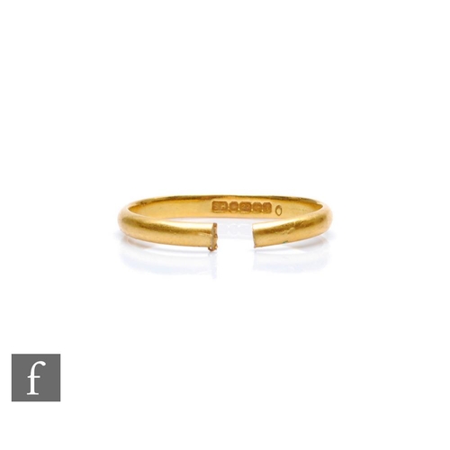 424 - A 22ct gold wedding band, cut and misshapen, weight 2g.