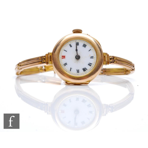 446 - An early 20th Century 9ct hallmarked manual wind wrist watch, Roman numerals to a white enamelled di... 