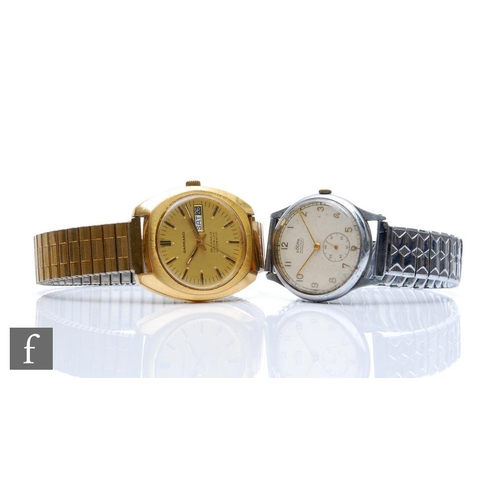 453 - A gentleman's gold plated Garrard automatic wrist watch and a Dogma plated cased wrist watch, serial... 