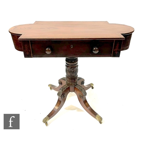 1054 - A 19th Century mahogany and rosewood cross-banded sofa table of cartouche outline, fitted with a sin... 