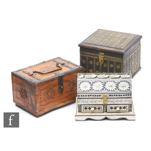 520 - A 20th Century Indian brass mounted square wooden box, a white painted casket fitted with two drawer... 