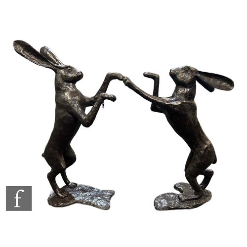 556 - A pair of contemporary bronze figures of boxing hares, bearing spurious signature after Mene, height... 