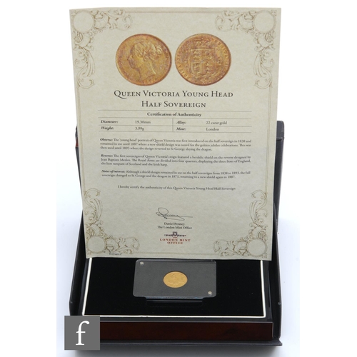 198 - A Victorian shield back half sovereign dated 1885, certificate, framed and boxed.