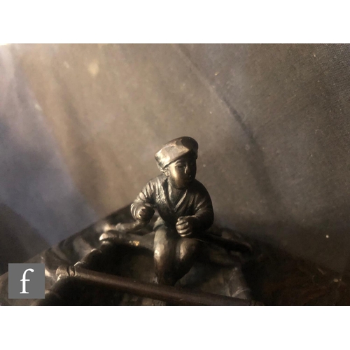 171 - A Japanese Meiji Period (1868-1912), bronze figure of a fisherman in a coracle, stamped character ma... 