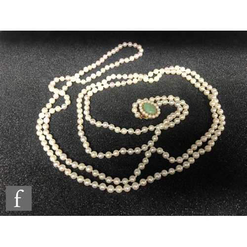 316 - A single row of uniform cultured pearls, length 156cm, each approximately 5mm diameter, terminating ... 