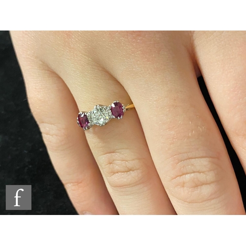 307 - An 18ct ruby and diamond three stone ring, central old cut diamond, weight approximately 0.40ct, fla... 