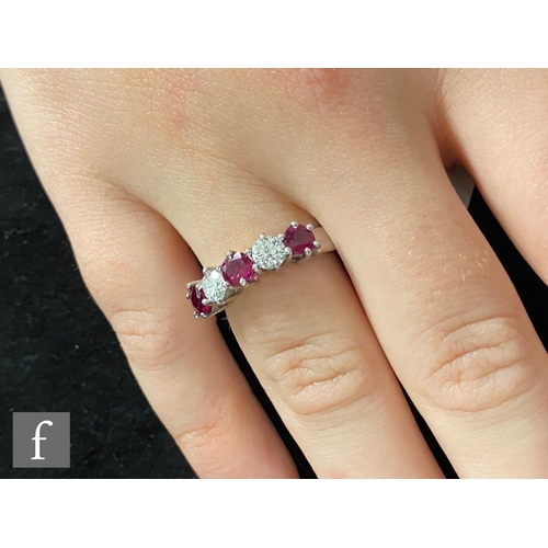 355 - An 18ct white gold ruby and diamond five stone ring, three rubies spaced by diamonds each approximat... 