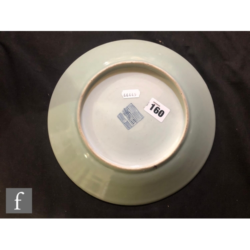 160 - A Chinese late Qing Dynasty (1644-1912) Celadon butterfly dish, the pale green ground picked out wit... 