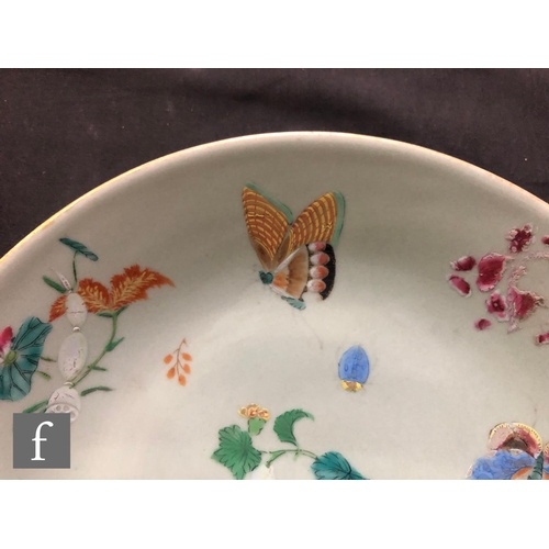 160 - A Chinese late Qing Dynasty (1644-1912) Celadon butterfly dish, the pale green ground picked out wit... 