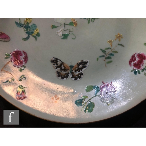 160 - A Chinese late Qing Dynasty (1644-1912) Celadon butterfly dish, the pale green ground picked out wit... 