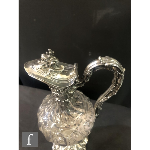 281 - A pair of late 19th Century French silver claret jugs, cushioned square bases with foliate details b... 