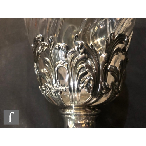 281 - A pair of late 19th Century French silver claret jugs, cushioned square bases with foliate details b... 