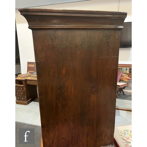 1053 - A George III walnut chest on chest, with moulded cornice pediment above an arrangement of eight draw... 