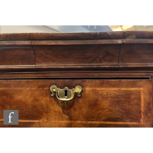 1053 - A George III walnut chest on chest, with moulded cornice pediment above an arrangement of eight draw... 